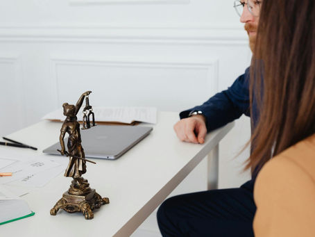 An injured worker discussing legal rights with a California workers' compensation attorney.