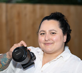 amanda smiling and holding a camera