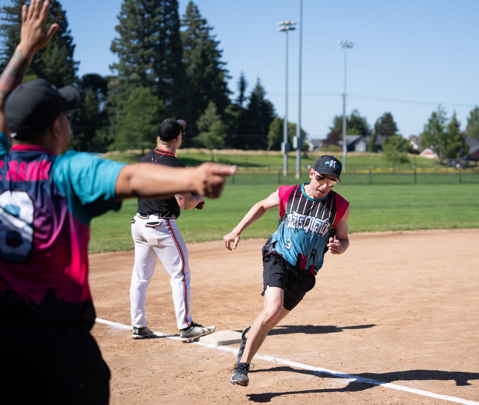 Person running bases on a baseball field.