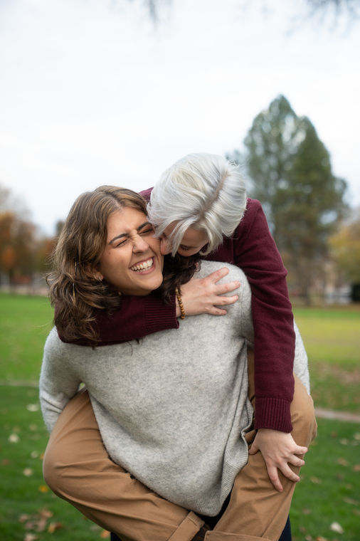 Two people enjoying a playful piggyback ride.