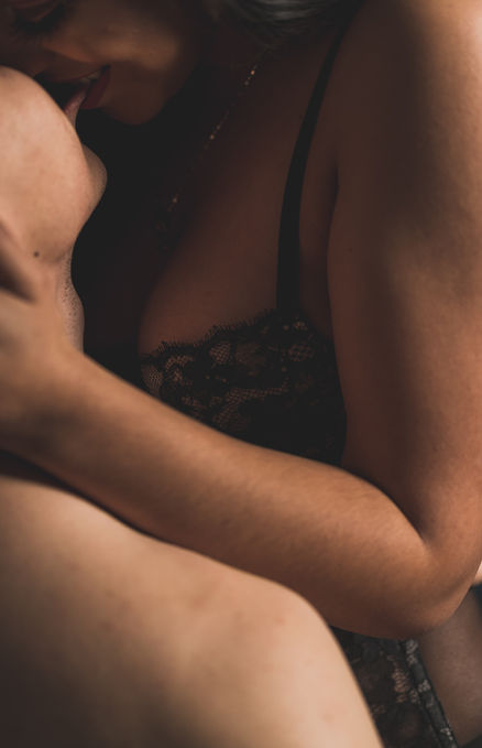 A person in a close-up, intimate pose.