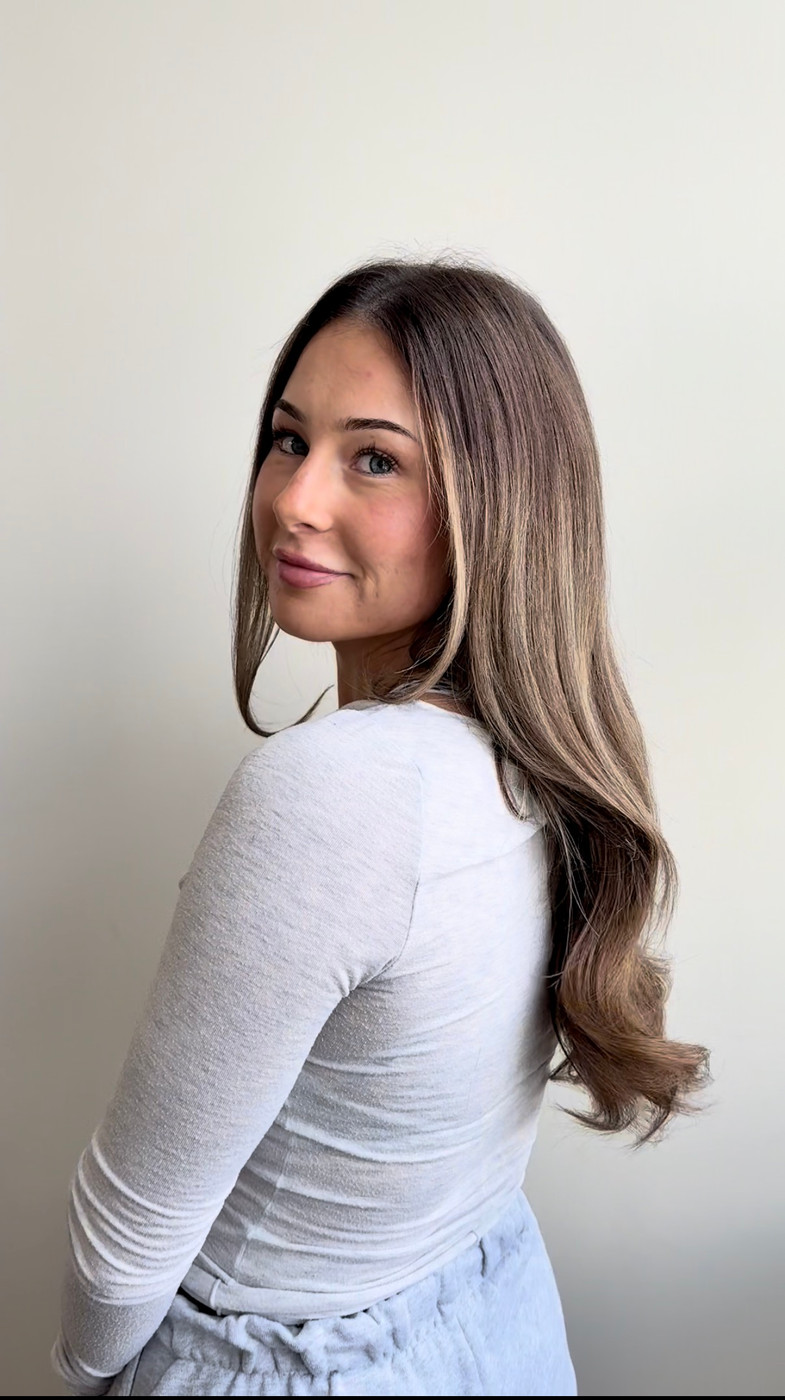 Long, full VoguePearl extensions, over-the-shoulder view