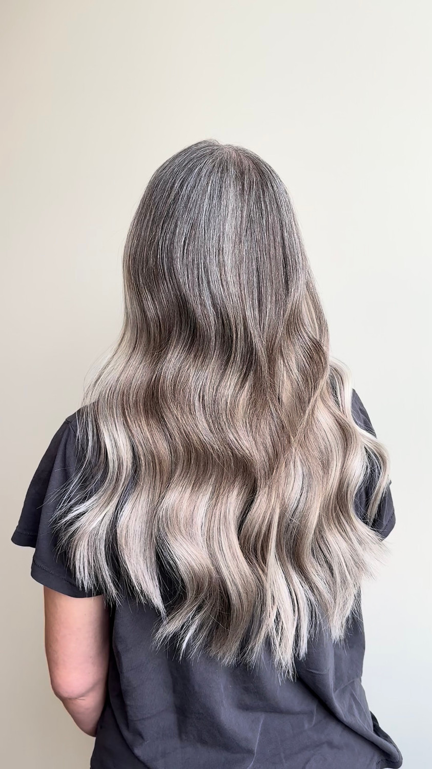Full, soft grey waves with 18-inch VoguePearl extensions, back view