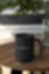 mockup-of-a-15-oz-coffee-mug-placed-on-a-wooden-table-31308.png