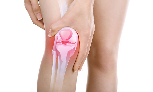 Young woman with knee pain isolated on w