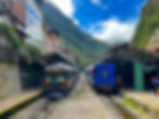 IncaRail and PeruRail trains in Aguas Calientes Peru