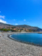 A beach in Funchal Praia do Almirante Reis with mountain views