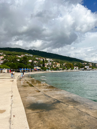 A swimming spot along the sea with mountain views in Opatija, Croatia