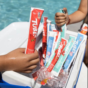 Yoplait yogurt tubes with a pool in the background