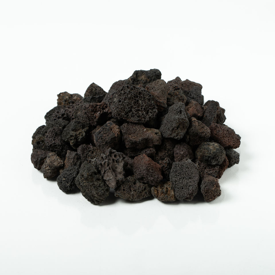 Pile of dark, porous Medium Bronze Lava Rock ( ½" - 1") on white background.