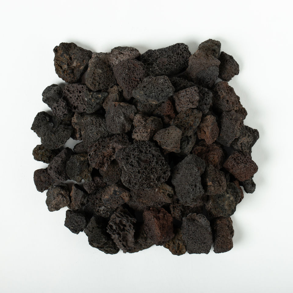 Pile of Medium Bronze Lava Rock ( ½" - 1") on a white background.