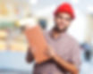 smiling-man-with-red-helmet-and-a-brick.jpg