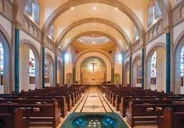 How does the design of a church reflect its denomination or religious tradition?