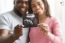 CNS african american couple holding baby ultrasound picture.webp