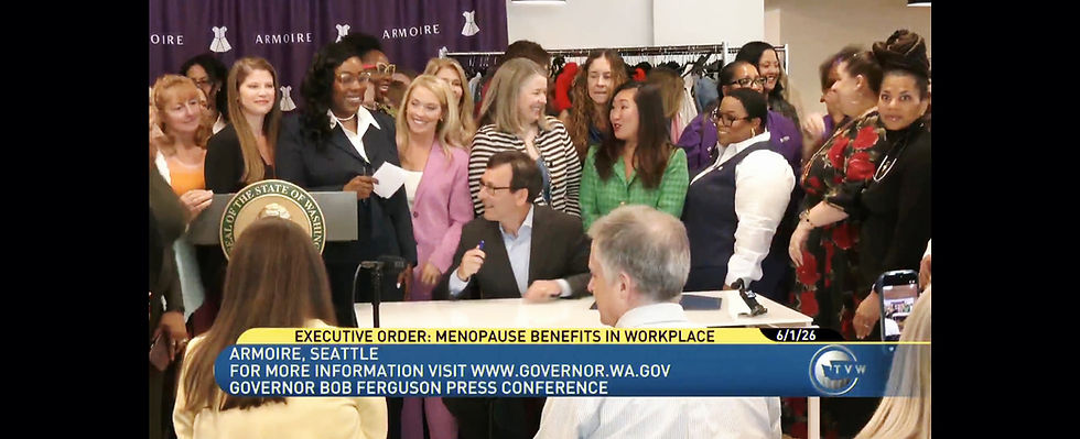 Video still of Quiana Daniels and supporters of Executive Order 26-01 gathered around the signing table with Washington Governor Bob Ferguson in a candid moment after the signing