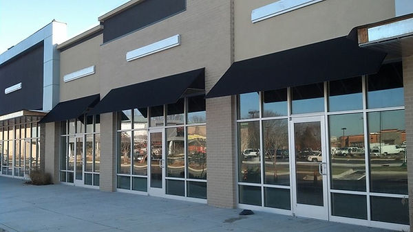 Storefront with tinted glass.