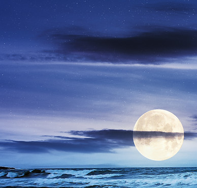 sea tide on a cloudy sunrise. green waves crashing golden sandy beach in full moon light. storm weather approaching. summer holiday concept.jpg