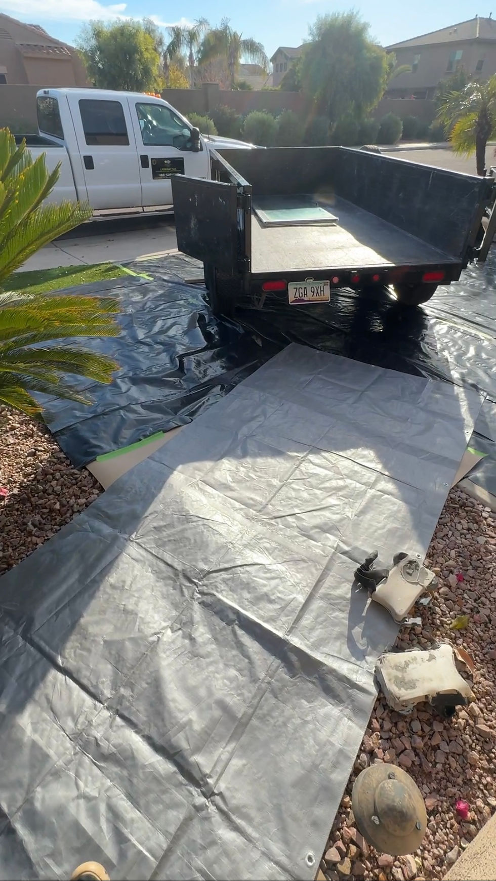 a dump trailer collecting demolishing debris from this bathroom remodel