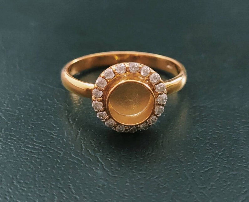 Gold Plated Over 925 Sterling Silver Round Bezel Ring With Small CZ Gemstones.