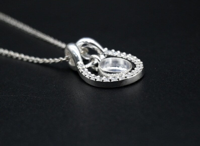 Thumbnail: Round Bezel Horse Shoe Good Luck Pendant With CZ In 925 Sterling Silver.