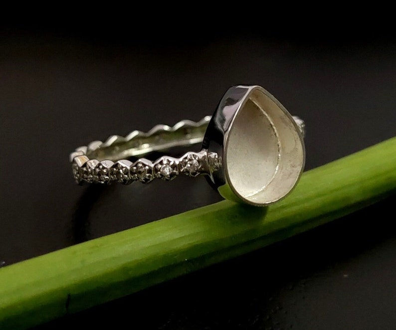 Sterling Silver Eternity Ring Bezel Setting For Pear Gemstone With Hexagon Band.