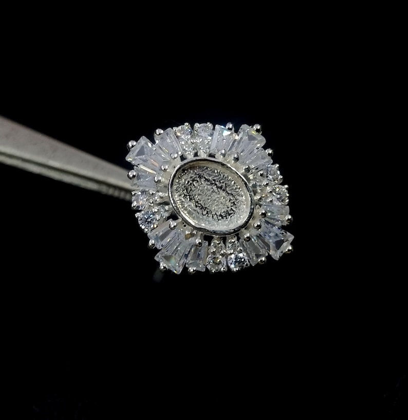 925 Sterling Silver Oval Shape Ring With Round & Tappered Baguette CZ Gemstone.