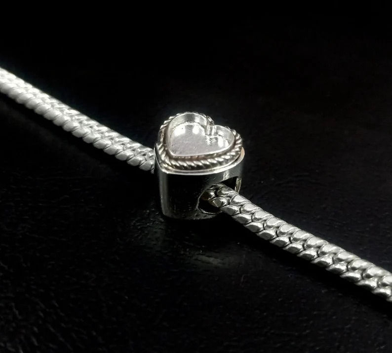Thumbnail: 925 Sterling Silver Sliding Beads Heart Shape With Rope Wire Surrounded.