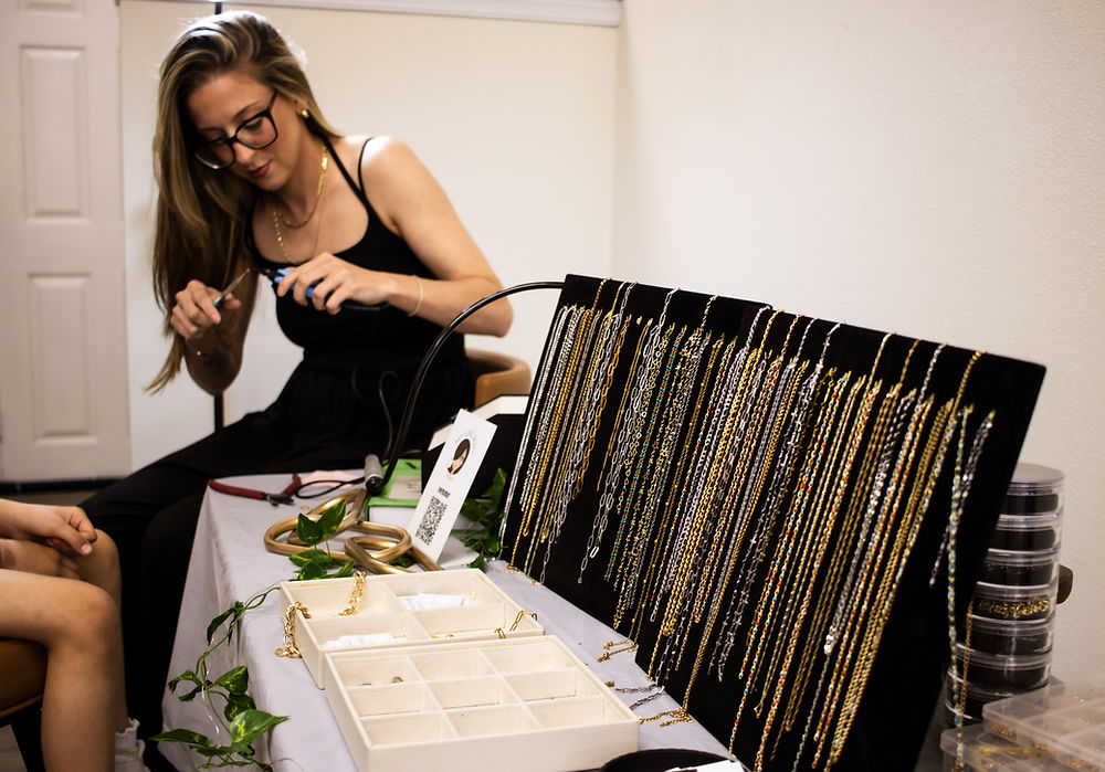Jewelry vendor display table at wellness and aesthetics event