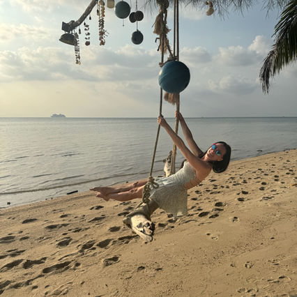 Kelly on a swing at the beach