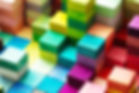 Spectrum of stacked multi-colored wooden blocks. Background or cover for something creativ