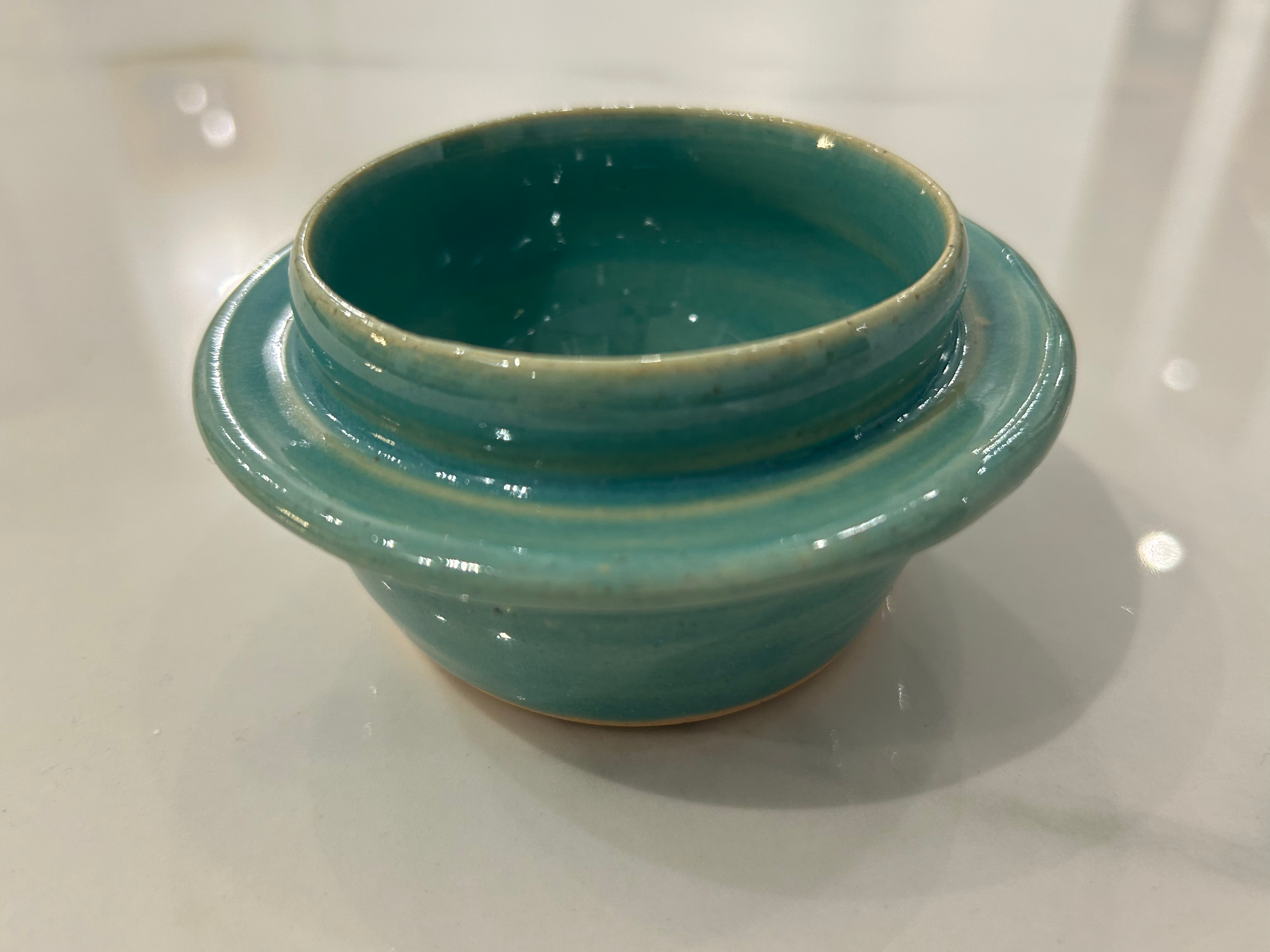 small turquoise bowl w/rim