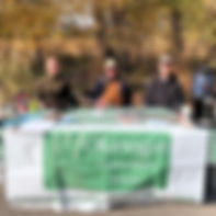 Image of Okanogan Staff sitting at a table with an OCD banner along the front