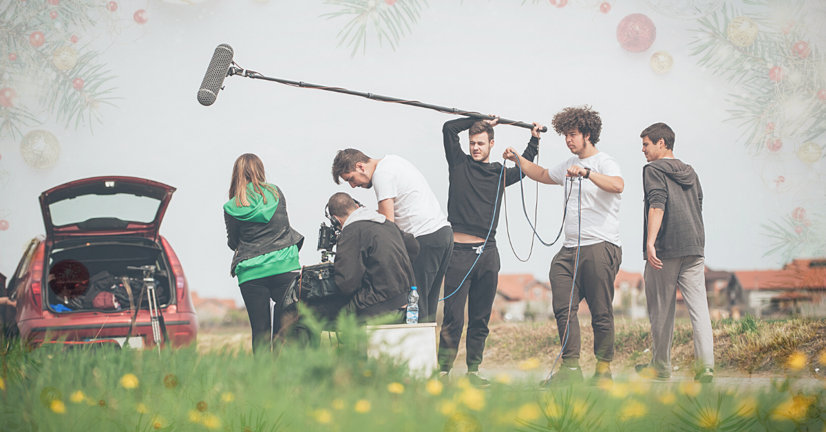 Film Crew standing outside with gear