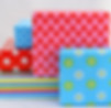 isolated-closeup-shot-gift-boxes-colorful-wrapping-stacked-top-each.jpg