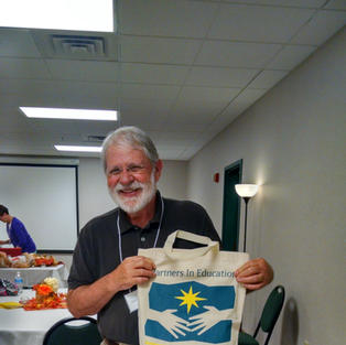 Ken Ostermiller & his Partners In Ed. bag