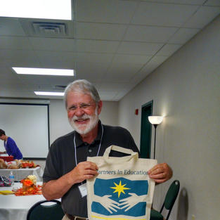 Ken Ostermiller & his Partners In Ed. bag