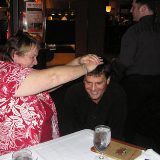 Susy Gaffney blesses a magician at an AU