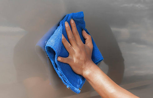 the-close-up-of-the-hand-is-cleaning-the-car_t20_bxd34p-scaled.jpg