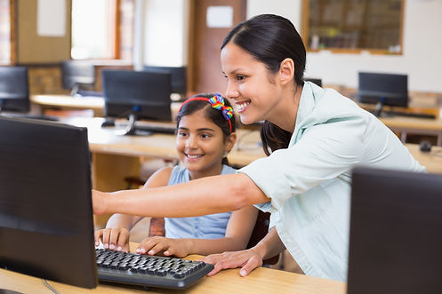 cute-pupil-computer-class-with-teacher.j
