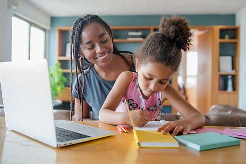 A mother helping her daughter with homeschool..jpg