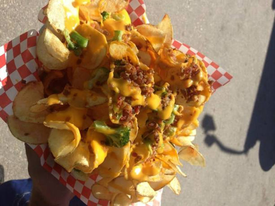 Broccoli Cheese Ribbon Fries - A heaping pile of ribbon fries smothered in scrumptious broccoli and cheese and topped with smoky bacon awaits you—the perfect combination of flavours to satisfy your palate. After the first bite, you might not want to share.