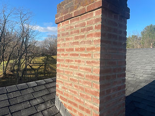 Repaired brick chimney after masonry restoration in Radford, VA