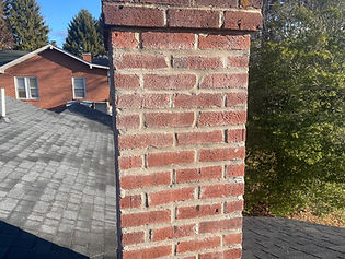 Repaired chimney with new brick and mortar on a Radford, VA home