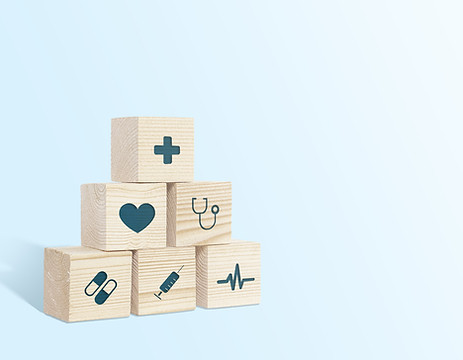 Medical symbols on wooden blocks. Medical and pharmaceutical concept. Medical treatment an
