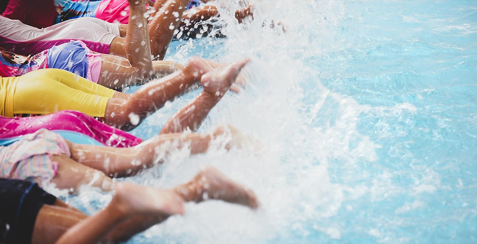 Kids splshing in the swimming pool water