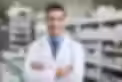 portrait-smiling-male-pharmacist-standing-with-arms-crossed-generative-by-ai_960080-2880.a
