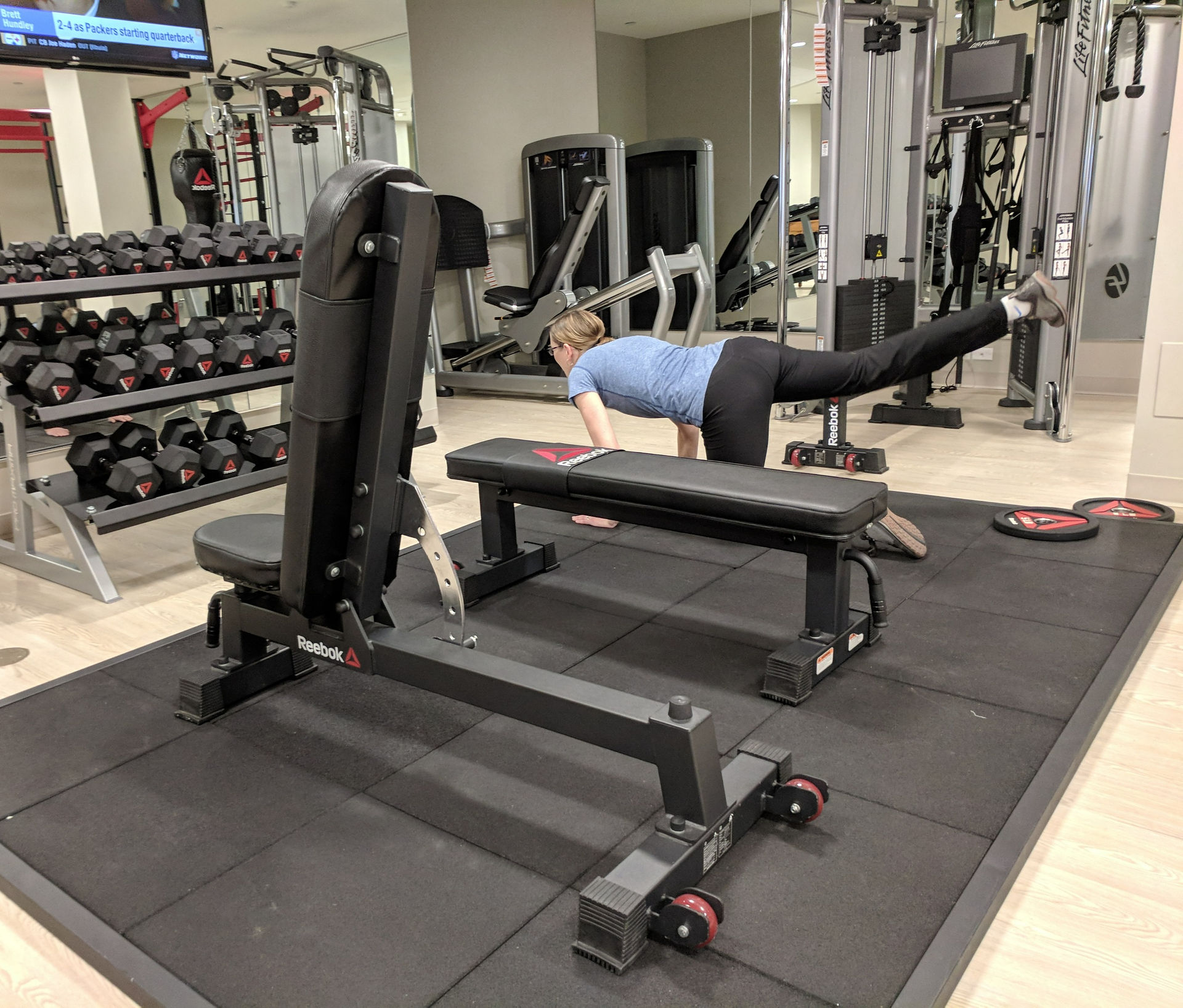 Laura exercising in a gym