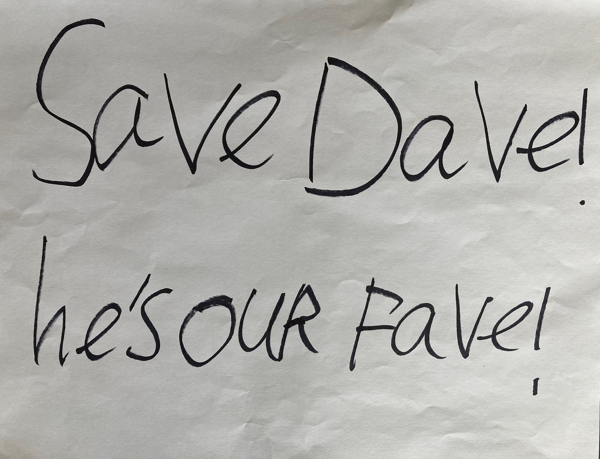 Sign saying "Save Dave! He's our fave!"