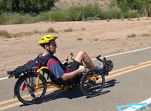 dave riding down road on trike.jpg