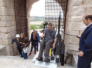 dave in wheelchair lift in europe.jpg